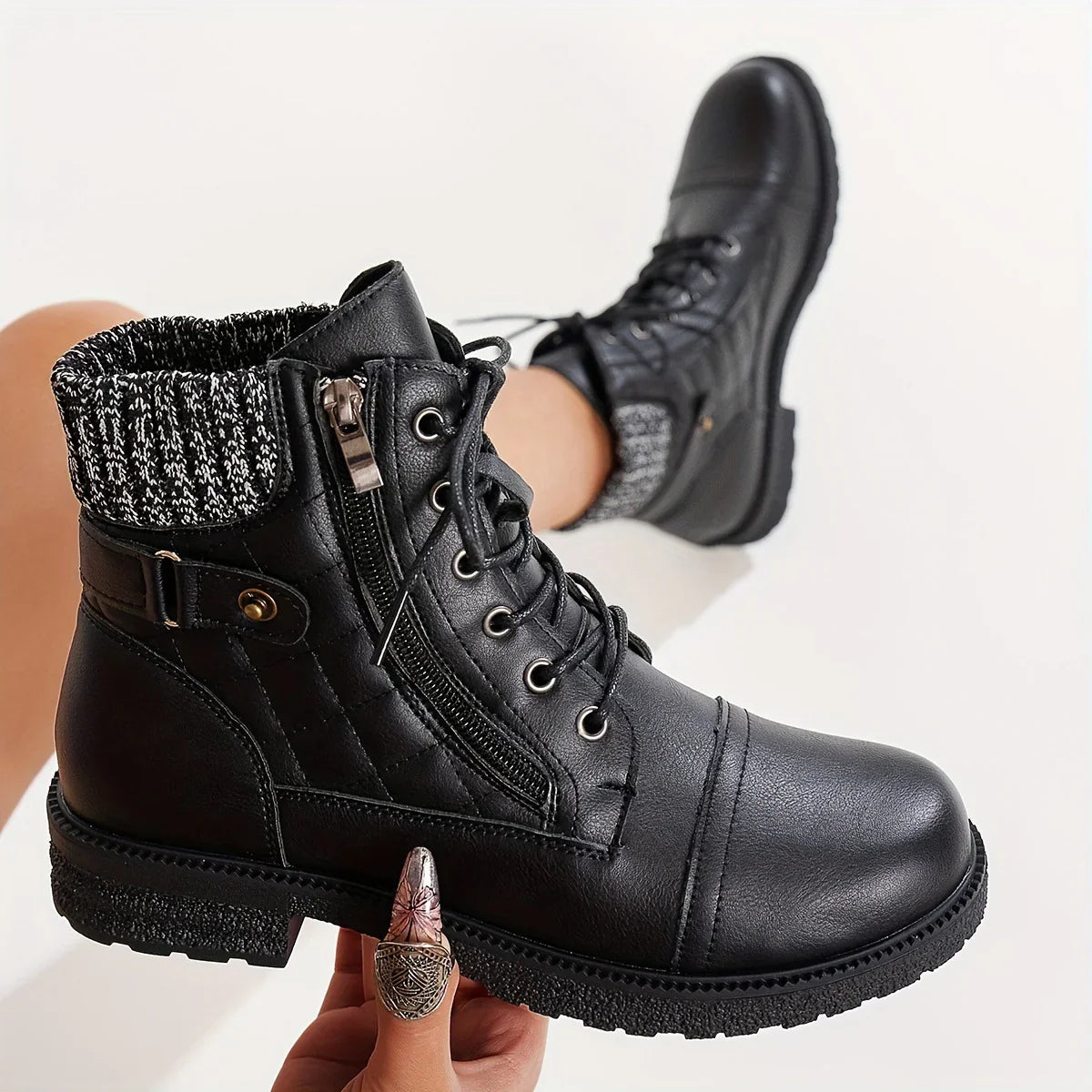 Black lace-up combat boots with side zipper, knit cuff, and chunky sole for women's fashion