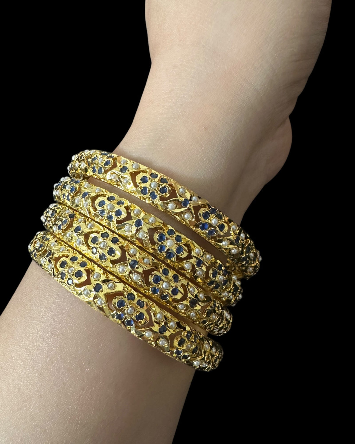 Amira Sapphire Pearl Bangles - Set of 4 — worn stacked on a wrist