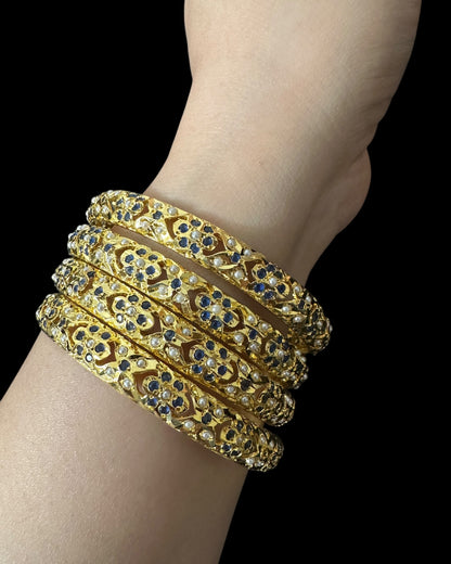 Amira Sapphire Pearl Bangles - Set of 4 — worn stacked on a wrist