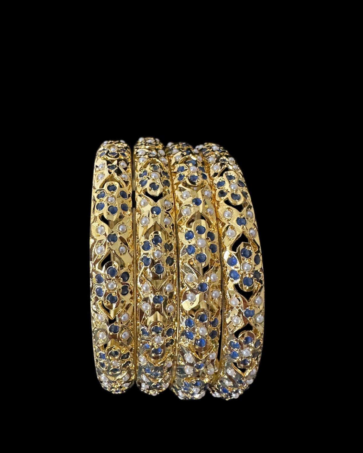 Amira Sapphire Pearl Bangles - Set of 4 — set of four stacked at an angle on a black background