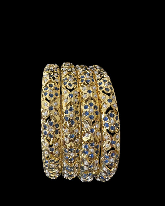 Amira Sapphire Pearl Bangles - Set of 4 — set of four stacked at an angle on a black background
