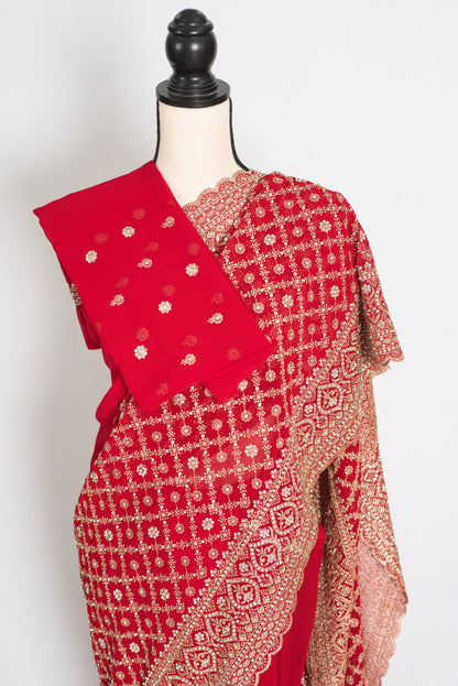 Eva Red & Gold Georgette Festive Saree — front view with the blouse piece draped over the shoulder