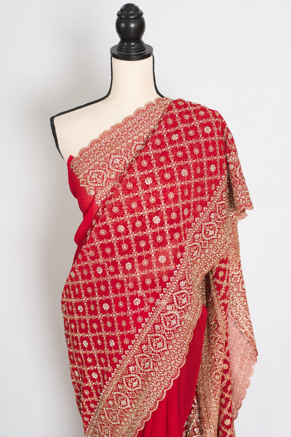 Eva Red & Gold Georgette Festive Saree — draped on a mannequin, three-quarter front view