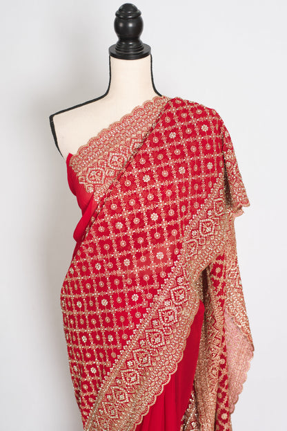 Eva Red & Gold Georgette Festive Saree — draped on a mannequin, three-quarter front view